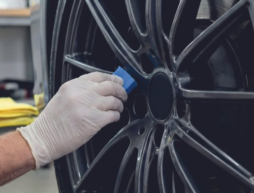 Detailing compound applied to a polishing pad